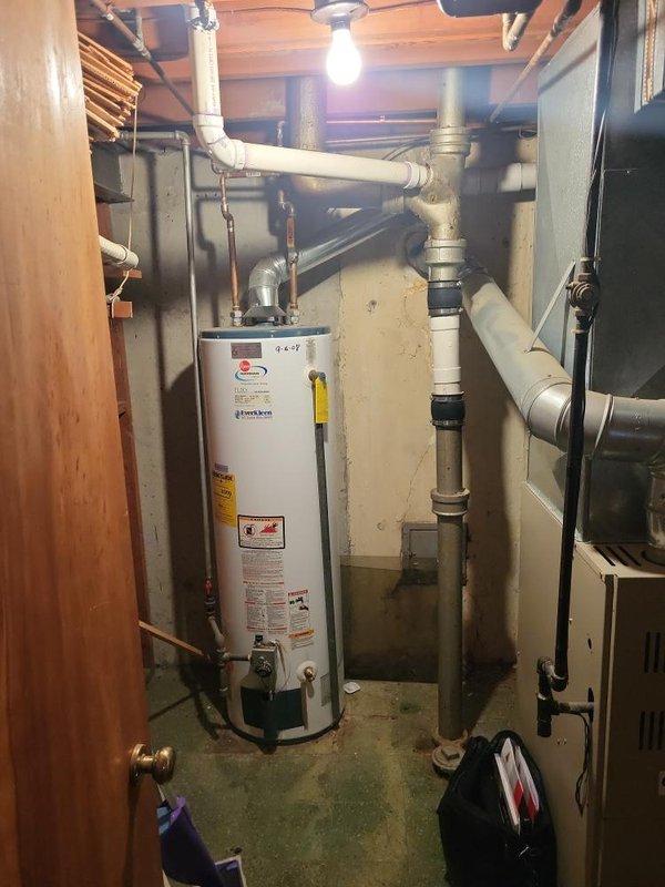 Conducted comprehensive assessment of existing 1997 HVAC system for replacement estimate, including natural gas furnace located in basement and air conditioning unit positioned outside. Evaluated current equipment condition, operational status, and installation environment including ductwork configuration, utility room layout, and accessibility for future replacement. Documented system specifications, clearance requirements, and existing infrastructure including venting, electrical connections, and condensate drainage to develop complete replacement proposal for both heating and cooling equipment.