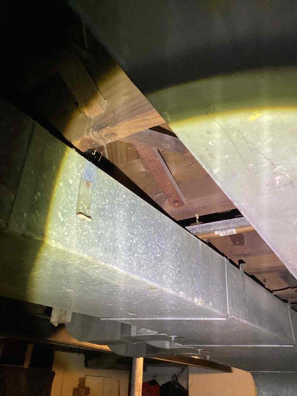 Conducted comprehensive site assessment for complete air conditioning system replacement. Evaluated existing attic installation conditions, including ductwork configuration, structural support requirements, and available access points. Documented current HVAC infrastructure, reflective insulation placement between ceiling joists, and existing plenum connections to provide accurate specifications for new system installation proposal.