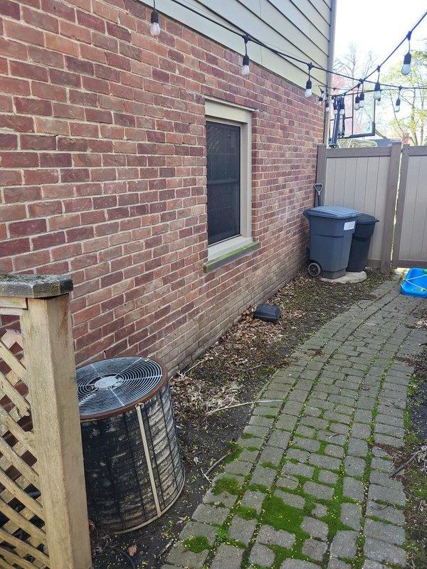 Conducted remeasure appointment for HVAC system replacement at residential property. Documented existing Comfortmaker super high-efficiency furnace installation in interior mechanical closet and outdoor cylindrical condenser unit positioned on exterior side yard against brick foundation. Captured measurements and photographic documentation of current equipment configuration, ductwork routing, PVC condensate lines, and available installation space to finalize replacement system specifications and prepare accurate estimate.