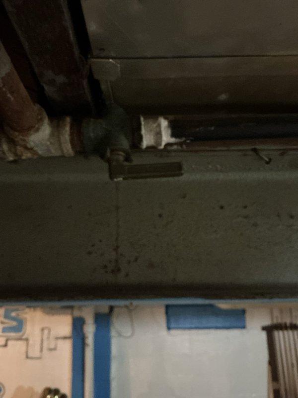 Responded to gas leak call in basement with gas system currently shut off. Located and isolated leak point on aging gas line infrastructure over ten years old. Performed pressure test on gas system to verify leak location and ensure system integrity. Completed repairs and restored safe gas service to residence. Documented conditions with photos showing basement piping configuration and gas appliance connections.