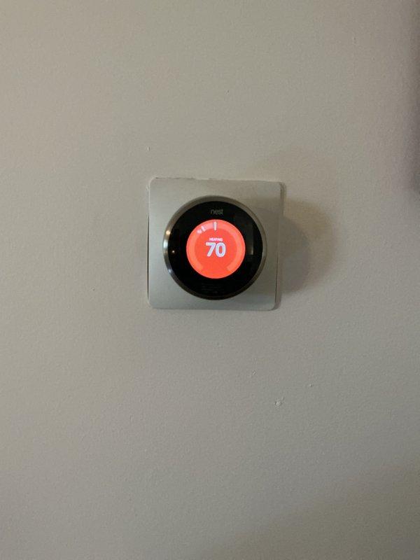 Responded to service call for failed motherboard on 3-year-old furnace system located in basement. Diagnosed control board failure preventing heating system operation. Replaced defective motherboard with new unit under Trane Supply Troy purchase order. Verified proper operation of furnace, confirmed communication with Nest thermostat showing heat mode at 70 degrees, and ensured humidifier integration functioning correctly. System restored to full operational status.