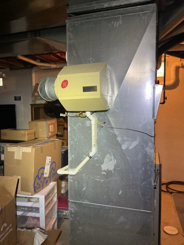 Responded to service call for failed motherboard on 3-year-old furnace system located in basement. Diagnosed control board failure preventing heating system operation. Replaced defective motherboard with new unit under Trane Supply Troy purchase order. Verified proper operation of furnace, confirmed communication with Nest thermostat showing heat mode at 70 degrees, and ensured humidifier integration functioning correctly. System restored to full operational status.
