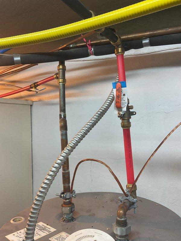 Completed installation and reconnection of a 40-gallon electric water heater. All hot and cold water supply lines were properly connected using copper piping with brass fittings, and electrical connections were secured through approved conduit. The unit was tested for proper operation and all connections were verified leak-free.