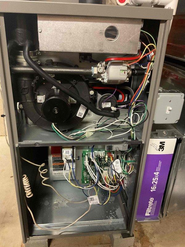 Responded to service call for 2-year-old furnace experiencing intermittent shutdowns in basement installation. Performed comprehensive diagnostic inspection of unit, examining internal components including blower motor assembly, control boards, heat exchanger, and all electrical connections. Inspected wiring harnesses, safety switches, flame sensor, and exhaust/intake piping for proper operation and potential fault conditions that could cause premature system shutdown.