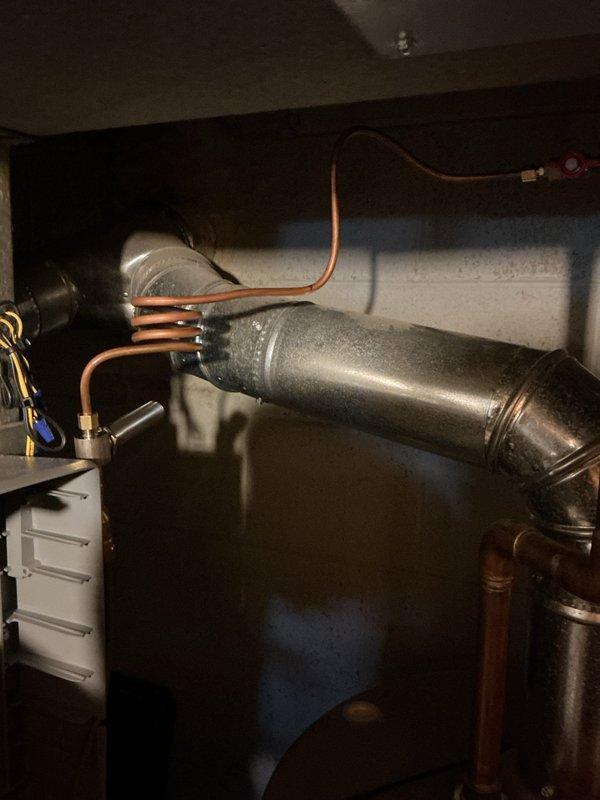 Installed small bypass duct assembly on existing HVAC system to regulate airflow and prevent excessive static pressure buildup. Routed copper refrigerant lines and secured connections to air handler unit, completing installation with proper electrical terminations and system testing to ensure optimal operation.