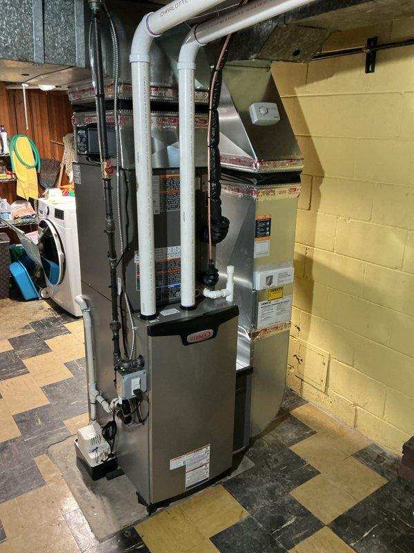 Completed full HVAC system installation including a 70,000 BTU Lennox furnace, 2.5 ton air conditioning unit, humidifier, 40-gallon hot water heater with recirculation pump, and APCO air purification system. Installed new thermostat and verified all electrical connections, including meter reconnection. Ran white PVC exhaust and intake venting for high-efficiency furnace with proper termination. Obtained mechanical and electrical permits prior to installation. Verified system operation, tested all safety controls, and confirmed proper airflow throughout. Registered equipment with AHRI certificate number 215659728 for utility rebate eligibility.