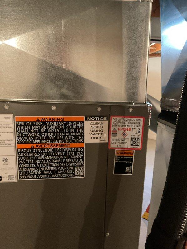 Completed installation of 5-ton air conditioning system with matching evaporator coil in basement location. Reconnected all electrical and mechanical connections, verified proper system operation, and ensured all safety labels and manufacturer specifications were properly displayed on equipment. Mechanical, electrical, and AC permits were requested and processed for the installation.
