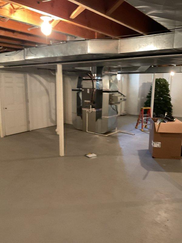 Completed installation of 5-ton air conditioning system with matching evaporator coil in basement location. Reconnected all electrical and mechanical connections, verified proper system operation, and ensured all safety labels and manufacturer specifications were properly displayed on equipment. Mechanical, electrical, and AC permits were requested and processed for the installation.