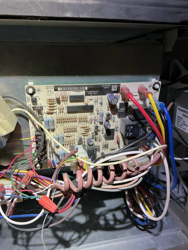 Responded to no-heat call for 5-year-old furnace located in basement. Upon inspection, identified failed control board as cause of system failure. Control board showed visible signs of component degradation and discoloration on circuit traces, preventing proper furnace operation. Documented board condition with detailed photos showing damaged PCB surface, compromised solder joints, and deteriorated electronic components. Explained findings to homeowner and provided options for repair or replacement of control board to restore heating functionality.