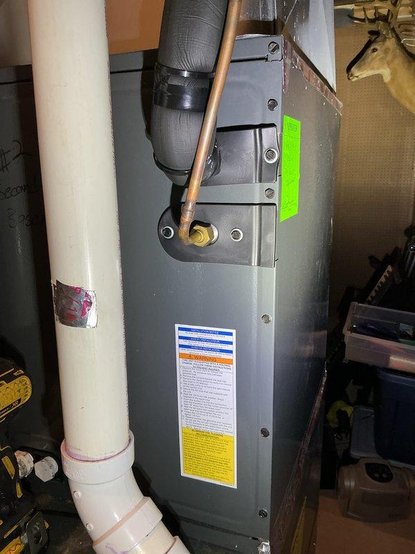 Returned to property to perform leak search following initial system re-diagnosis. Inspected both AC units located on side of home, confirmed both systems operational with no refrigerant leaks detected at time of inspection. Verified proper operation of indoor air handler and outdoor condensers, documented equipment condition with photos showing normal wear patterns and proper installation of refrigerant lines and electrical connections.