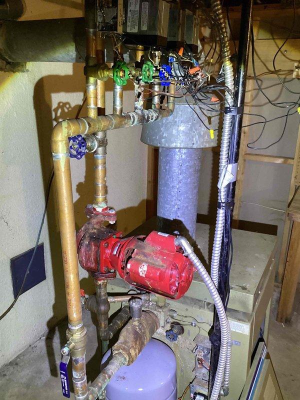 Responded to a residential property undergoing remodeling where copper piping had been stolen from the hot water boiler system. Conducted diagnostic evaluation of the existing boiler and remaining mechanical components in the basement, including assessment of the pressure tank, circulator pump, and electrical panel. Provided two estimate options: complete boiler and piping replacement to restore the existing hot water heating system, or full conversion from hot water boiler to forced air heating system with new ductwork throughout the home.