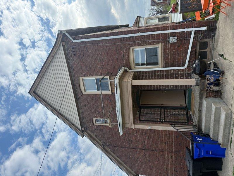 Responded to service call for rainwater intrusion into main electrical panel from meter location. Upon inspection, found significant rust and corrosion on panel enclosure exterior and mounting frame, confirming moisture exposure issues. Assessed all circuit breakers and internal wiring connections for water damage and safety concerns. Documented existing panel condition showing weathering on exterior metal housing while verifying all circuits remained operational. Provided recommendations for proper weatherproofing and sealing of meter-to-panel connection point to prevent future water infiltration and potential electrical hazards.