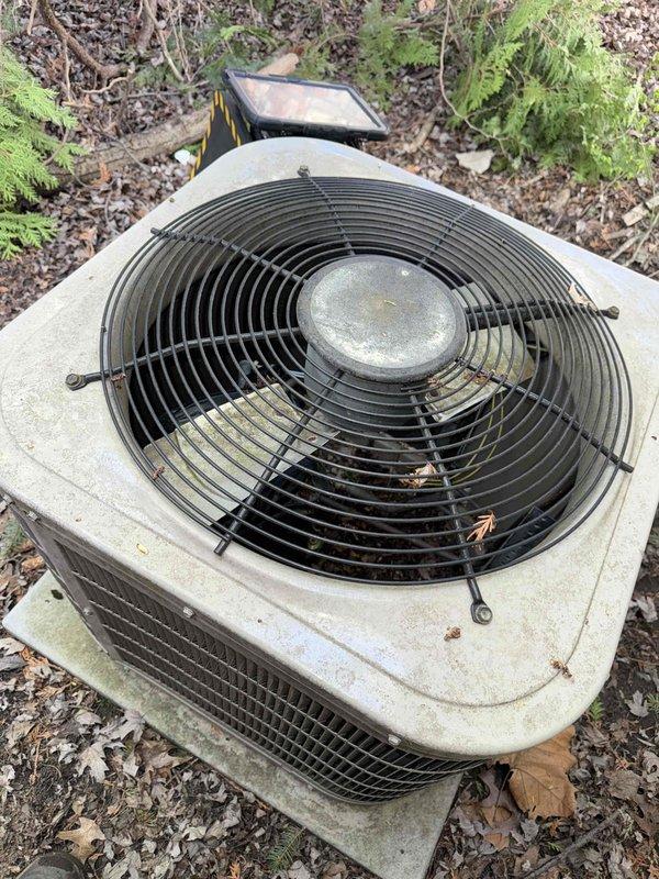 Responded to no-cooling call on 10+ year old air conditioning system located in basement. Upon arrival, performed diagnostic evaluation of outdoor condensing unit that failed to start when turned on. Using digital multimeter and clamp meter, tested electrical components and measured amperage draw to determine system operability. Found unit non-functional and assessed overall condition of aged equipment surrounded by debris and showing signs of weathering. Documented findings with diagnostic measurements and provided assessment regarding potential need for system replacement.