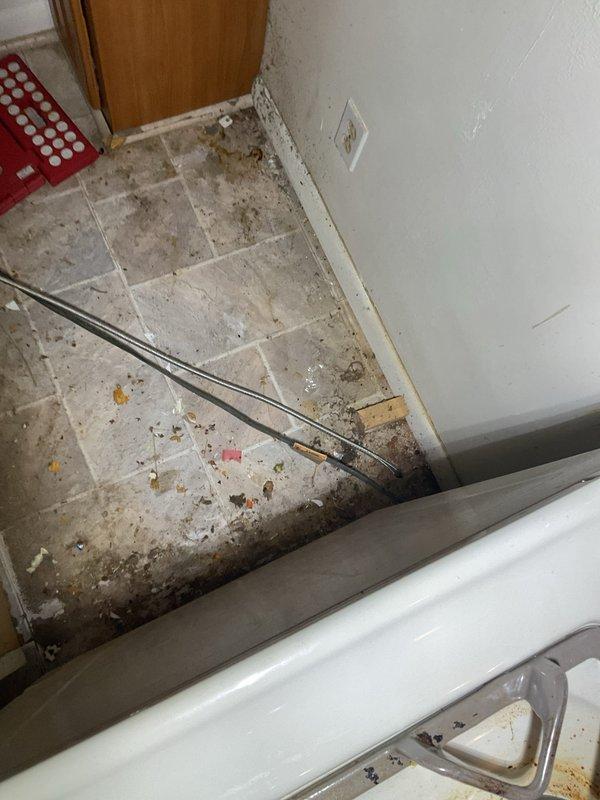 Replaced faulty icemaker supply valve and connecting hose assembly to restore water supply to refrigerator ice maker. Accessed plumbing connections in basement ceiling space, removed old valve and deteriorated supply line, installed new chrome shut-off valve with braided stainless steel flex line, and verified proper water flow and leak-free connections upon completion.