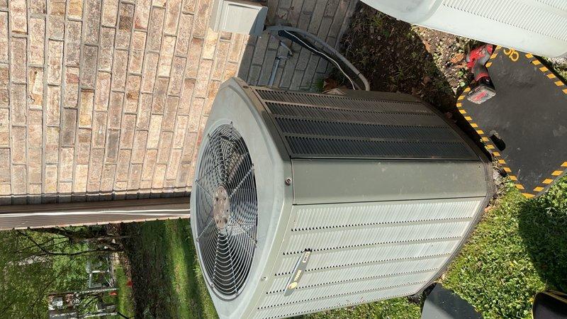 Completed comprehensive Gold AC Inspection and preventative maintenance on three 17-year-old air conditioning systems located in the attic, basement, and garage. Performed thorough tune-up procedures on all units including inspection of condenser coils, fan assemblies, electrical connections, capacitors, and contactors. Documented existing conditions with photographic evidence showing outdoor condenser unit with cylindrical configuration, protective fan guard, and unit placement on concrete pad. Inspected electrical control panel and disconnect box, noting age-related corrosion and weathering on metal components and housing consistent with 17-year-old equipment exposed to outdoor conditions. Verified proper operation of all three systems and ensured standard HVAC control wiring connections were secure across all units.