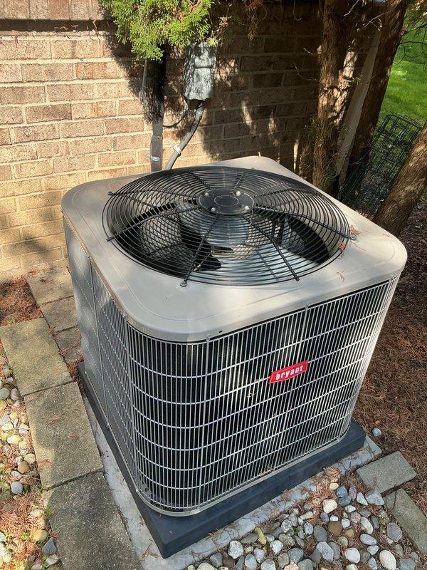 Completed comprehensive Gold AC Inspection on a 5-year-old Bryant air conditioning system with air handler located in basement. Performed thorough examination of outdoor condenser unit, verified proper operation of compressor and fan motor, inspected electrical connections and disconnect box, checked refrigerant levels and system pressures, cleaned condenser coils, and assessed overall system performance. Unit found in good working condition with no immediate service needs identified, all components operating within manufacturer specifications.