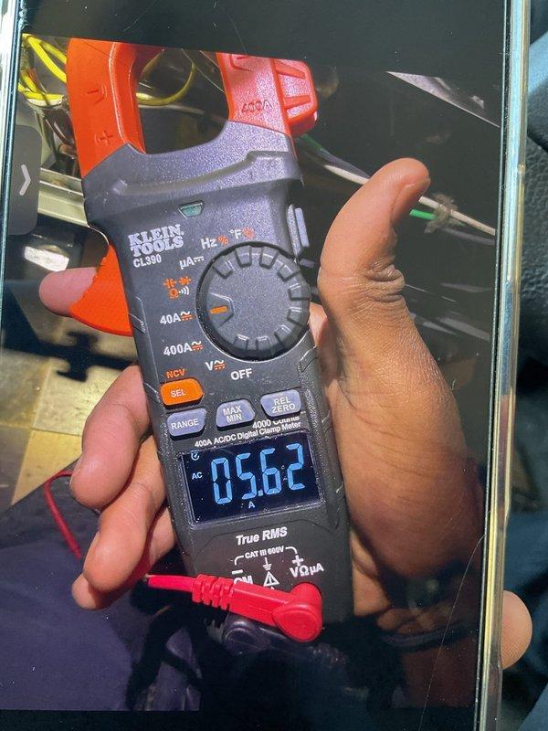 Responded to service call for loud harmonic humming noise from blower motor during system operation, with noise more pronounced during cooling cycle. Upon inspection, measured blower motor amperage at 56.2 amps using digital clamp meter to diagnose potential electrical or mechanical issues. Inspected furnace burner assembly and internal components for any loose mounting hardware or debris that could contribute to vibration and noise. System remained operational with ability to heat and cool throughout diagnostic process.