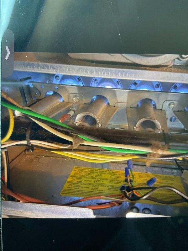Responded to service call for loud harmonic humming noise from blower motor during system operation, with noise more pronounced during cooling cycle. Upon inspection, measured blower motor amperage at 56.2 amps using digital clamp meter to diagnose potential electrical or mechanical issues. Inspected furnace burner assembly and internal components for any loose mounting hardware or debris that could contribute to vibration and noise. System remained operational with ability to heat and cool throughout diagnostic process.