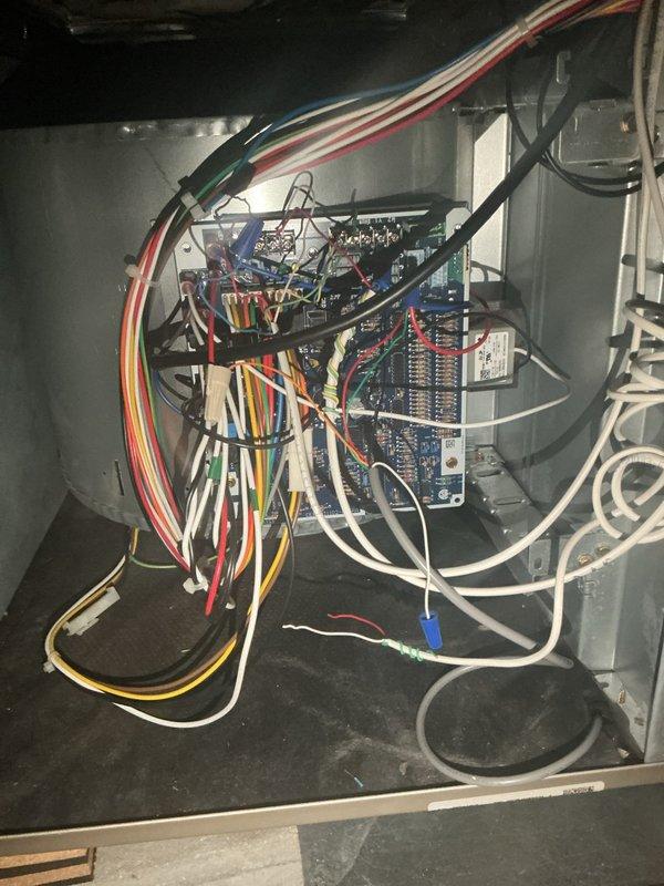 Responded to no-cool complaint on 6-year-old residential AC system located in attic. Customer reported unit would not shut off when switching between cooling and heating modes. Upon inspection, identified faulty thermostat causing continuous operation and failure to properly cycle equipment. Diagnosed touchscreen Sensi thermostat as defective with malfunctioning relay control preventing proper system shutdown. Verified control board wiring and connections at air handler were intact with no visible damage to low-voltage wiring or terminal connections. Confirmed thermostat replacement required to restore proper system operation and cycling control. Unit currently set to cooling mode displaying 64°F. Replacement thermostat ordered and available for installation to resolve cycling issue and restore normal heating/cooling functionality.