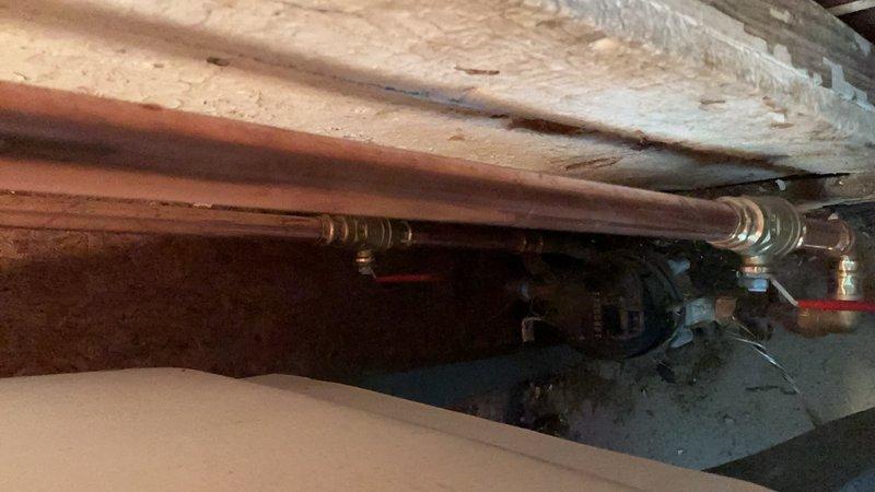 Returned to complete water service upgrade work previously scheduled when city water shutoff was required. City did not shut off water as planned; however, proceeded with all accessible work. Successfully completed replacement of water lines and installation of new copper piping throughout the system, with exception of main #1 valve which requires city water shutoff to safely replace. Installed tankless water heater unit with proper connections and shut-off valves. 

Unable to complete laundry tub hookup and associated water line connections as these components are located directly above the water meter and cannot be properly installed until the #1 valve replacement is completed. Advised that bathroom lavatory and kitchen faucets will require replacement due to significant debris accumulation from the old galvanized piping system. These faucets can be installed during the return visit if parts are available on-site.

Pressurized the entire plumbing system and conducted comprehensive le