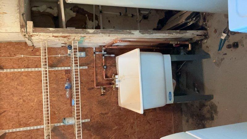 Returned to complete water service upgrade work previously scheduled when city water shutoff was required. City did not shut off water as planned; however, proceeded with all accessible work. Successfully completed replacement of water lines and installation of new copper piping throughout the system, with exception of main #1 valve which requires city water shutoff to safely replace. Installed tankless water heater unit with proper connections and shut-off valves. 

Unable to complete laundry tub hookup and associated water line connections as these components are located directly above the water meter and cannot be properly installed until the #1 valve replacement is completed. Advised that bathroom lavatory and kitchen faucets will require replacement due to significant debris accumulation from the old galvanized piping system. These faucets can be installed during the return visit if parts are available on-site.

Pressurized the entire plumbing system and conducted comprehensive le