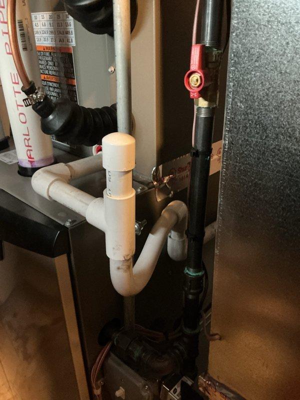 Completed system start-up and commissioning of newly installed HVAC system, including outdoor condensing unit and indoor air handler equipment. Verified proper refrigerant charge levels using manifold gauges at outdoor unit service ports, confirmed all electrical connections and safety labels were in place, and tested condensate drain P-trap configuration for proper operation. System operational checks confirmed unit is functioning within manufacturer specifications with all components operating correctly.