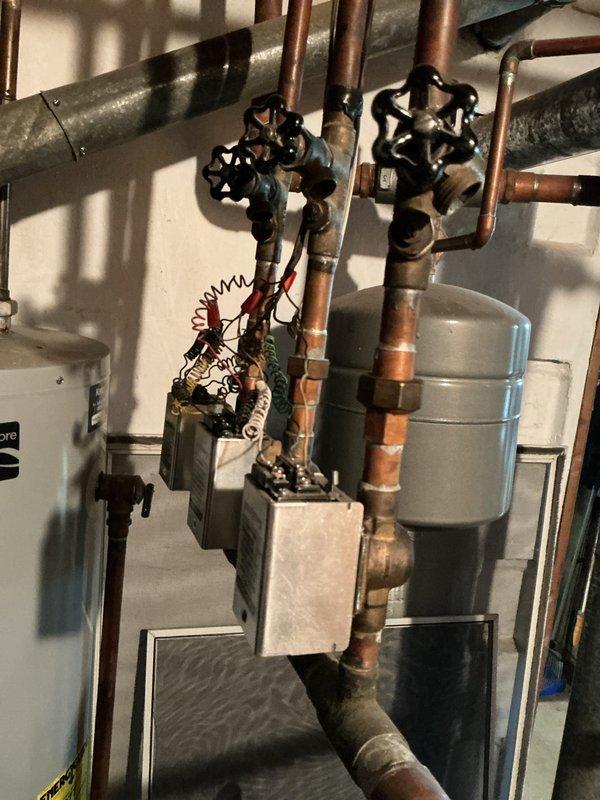 Completed diagnostic evaluation on 20-year-old power vented hot water boiler system serving three heating zones in basement location. Customer reported clattering noise from boiler motor upon initial contact. Inspection revealed 1989 model boiler with failed inducer motor assembly, which presented significant availability and replacement challenges due to age of equipment. Provided comprehensive estimate for complete boiler replacement as most viable solution given equipment age, failed component obsolescence, and overall system condition.