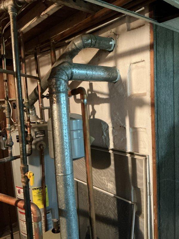Completed diagnostic evaluation on 20-year-old power vented hot water boiler system serving three heating zones in basement location. Customer reported clattering noise from boiler motor upon initial contact. Inspection revealed 1989 model boiler with failed inducer motor assembly, which presented significant availability and replacement challenges due to age of equipment. Provided comprehensive estimate for complete boiler replacement as most viable solution given equipment age, failed component obsolescence, and overall system condition.