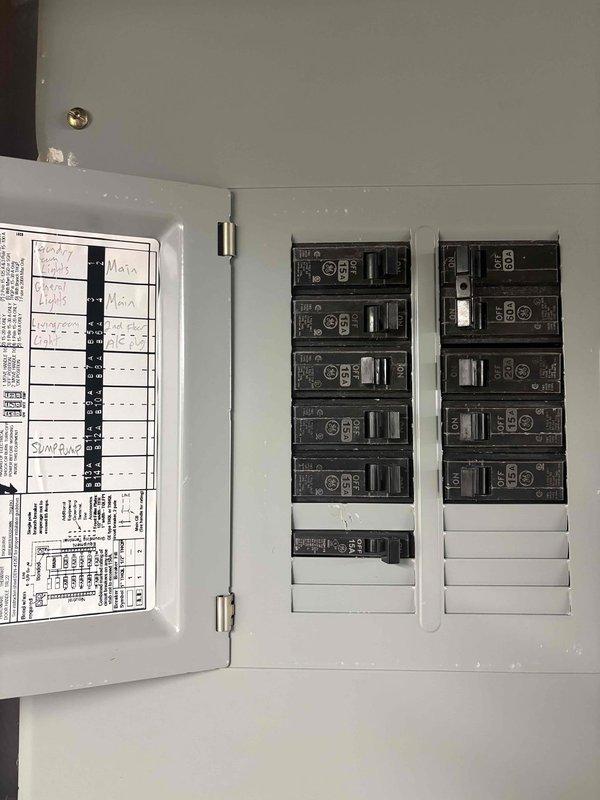 Performed electrical inspection of light fixture wiring throughout home with older electrical system. Evaluated electrical panel and circuit breaker configuration, documented existing wiring conditions including flexible metal conduit and cable routing in ceiling/attic spaces. Assessed fixture wiring compatibility and identified circuits requiring attention for safe operation of lighting fixtures.