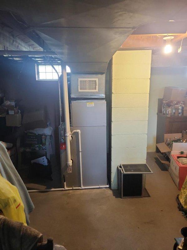 Responded to service call for air conditioning system that failed to start when condenser was activated. Performed diagnostic evaluation on 10+ year old AC unit located in basement utility area. Upon inspection and testing, determined system was not operational and provided estimate for complete AC replacement due to age and condition of existing equipment.