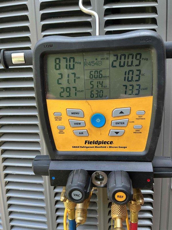 Completed system start-up and commissioning on two AC units with basement coil installation. Utilized refrigerant manifold with micron gauge to verify proper system pressures and temperatures, confirming refrigerant charge levels, subcooling, and superheat measurements were within manufacturer specifications for optimal system performance and efficiency.