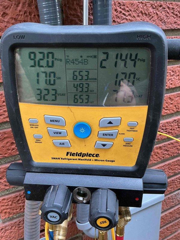 Completed system start-up and commissioning on two AC units with basement coil installation. Utilized refrigerant manifold with micron gauge to verify proper system pressures and temperatures, confirming refrigerant charge levels, subcooling, and superheat measurements were within manufacturer specifications for optimal system performance and efficiency.