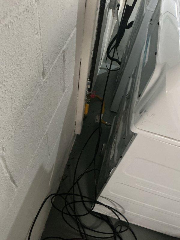 Completed gas dryer hookup to existing gas line at newly remodeled residence. Installed gas line connector and dryer vent at single location where appliance was already positioned. All connections tested and verified for proper operation and safety compliance.