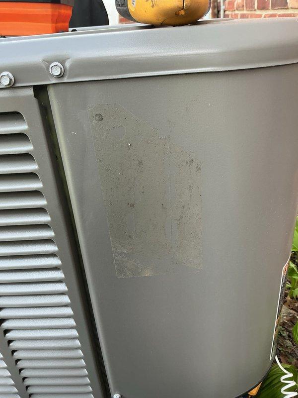 Completed comprehensive Gold AC Inspection and spring maintenance tune-up on outdoor air conditioning unit located at rear of property. Performed complete system evaluation including inspection of exterior casing which showed typical environmental wear and dirt accumulation, cleaned and assessed all accessible components, checked refrigerant levels, tested electrical connections and capacitors, verified proper airflow through condenser coils, and ensured all safety controls were functioning correctly. Unit operational and ready for cooling season with no immediate repairs required at time of service.