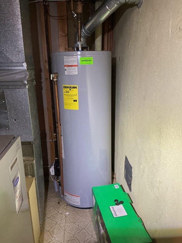 Completed comprehensive Gold AC Inspection and spring maintenance tune-up on outdoor air conditioning unit located at rear of property. Performed complete system evaluation including inspection of exterior casing which showed typical environmental wear and dirt accumulation, cleaned and assessed all accessible components, checked refrigerant levels, tested electrical connections and capacitors, verified proper airflow through condenser coils, and ensured all safety controls were functioning correctly. Unit operational and ready for cooling season with no immediate repairs required at time of service.
