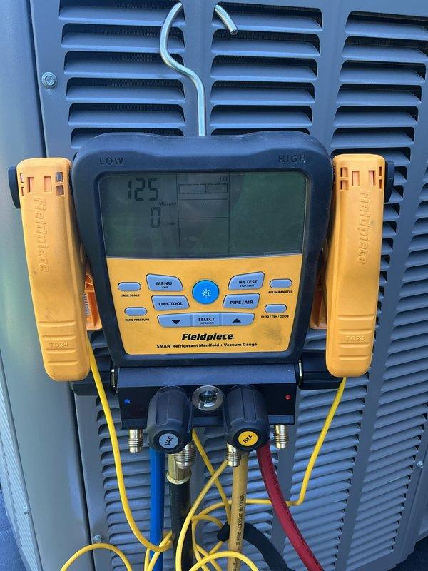 Completed full HVAC system installation including a 70,000 BTU furnace and 2-ton air conditioning unit with rear discharge configuration. Installed humidifier, condensate pump, and all necessary ductwork connections. Requested mechanical and electrical permits prior to installation. Performed complete system startup, refrigerant charging, and vacuum testing using manifold gauges to verify proper pressurization and system integrity. Reconnected all electrical and gas connections per manufacturer specifications. System tested and operational, meeting all code requirements. Documentation submitted for utility rebates through Consumers Energy and DTE Energy programs. AHRI certificate number recorded for rebate processing.
