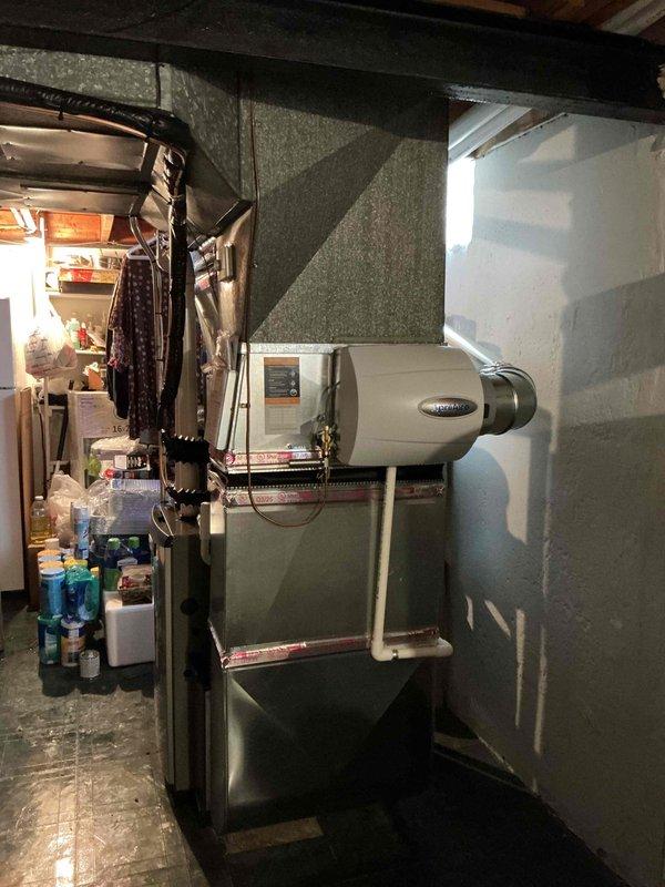 Completed full HVAC system installation including 45,000 BTU furnace with integrated humidifier and 2-ton air conditioning unit with rear discharge configuration. Installed new thermostat and reconnected existing electrical service. Routed PVC condensate drain lines to exterior with proper pitch and termination point. Verified all ductwork connections, sealed joints, and insulated exposed runs. Tested system operation across all heating and cooling modes, confirmed proper airflow at 500 CFM, and validated humidifier function. Obtained mechanical and electrical permits prior to installation. System qualified for utility rebate program and all documentation submitted accordingly.