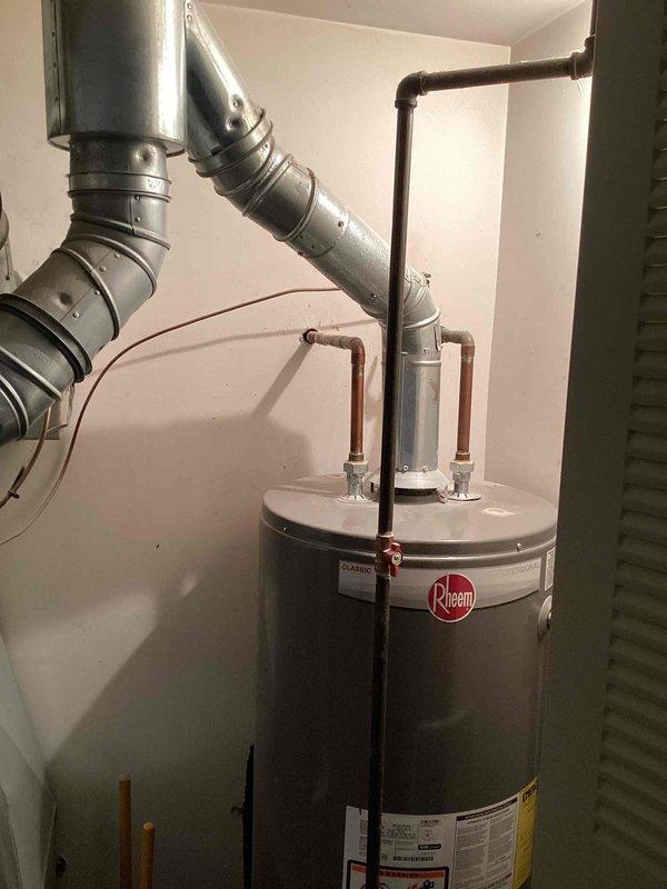 Completed on-site assessment for replacement estimate of 18-year-old furnace and air conditioning system located in basement. Current natural gas furnace and AC unit operational but nearing end of service life. Evaluated existing HVAC infrastructure including galvanized ductwork configuration, exhaust venting system, and condensate drainage. Documented equipment layout, spatial constraints, and existing utility connections. Photographed current installation to determine replacement equipment specifications and identify any modifications required for new system installation.