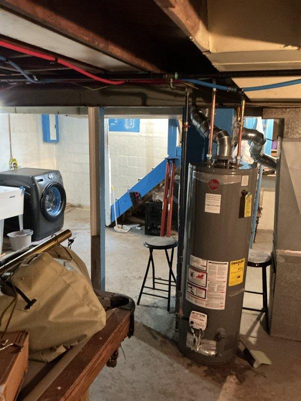 Completed plumbing inspection and assessment of basement utility area. Water heater and associated copper piping connections were examined and photographed for documentation purposes. All mechanical systems, including HVAC unit and related ductwork, were visually inspected to ensure proper operation and identify any potential service needs.