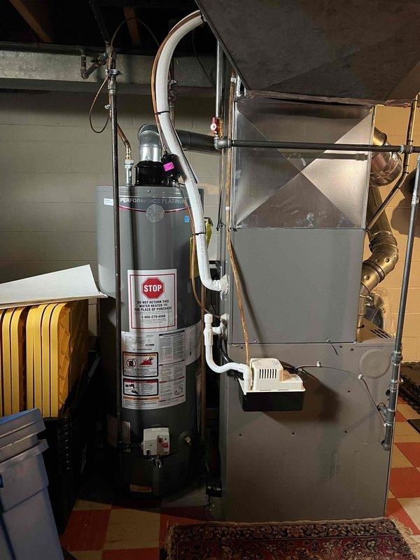 # Furnace Tune-Up Summary

Provided courtesy call one hour prior to arrival as requested. Performed comprehensive tune-up on 12-year-old furnace located in basement. Conducted full system diagnostics using digital multimeter to verify electrical performance and safety parameters. Inspected all mechanical components, burner assembly, heat exchanger, and blower motor. Tested and confirmed proper operation of all safety controls and limit switches. System operating within manufacturer specifications upon completion.

# Detailed Work Performed

Arrived on-site and accessed basement utility area where furnace is installed adjacent to water heater. Began systematic inspection of 12-year-old heating unit. Removed access panels to examine internal components and burner chamber.

Utilized digital multimeter to measure voltage and amperage across key electrical connections. Verified proper voltage supply to control board and confirmed amperage draw on blower motor within acceptable range. Tested