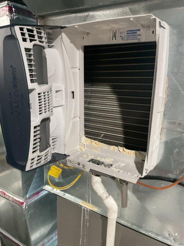 Completed warranty service to reorient media cabinet from winter installation to customer's preferred direction as approved by management. Repositioned HVAC cabinet 180 degrees to face opposite direction, ensuring proper clearances maintained and all ductwork connections remain secure. Documented final configuration with photos showing furnace, air handler, and associated ductwork in new orientation with system operational.