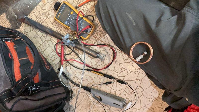 Completed comprehensive Gold-level maintenance inspection on residential split-system air conditioning unit (2 years old) located in attic and steam boiler system (18 years old) in basement. Performed thorough diagnostic testing using digital multimeter and specialized HVAC testing equipment to verify electrical components, refrigerant pressures, and system operations. Inspected heat exchanger, evaporator coil, condensate drainage, and all mechanical components; noted deteriorated insulation material on boiler unit showing significant aging and discoloration that may require future attention for improved efficiency and safety.