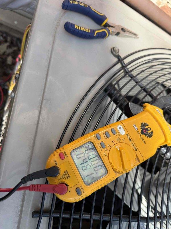 # HVAC Maintenance - Gold AC Inspection

Completed comprehensive Gold AC inspection on a single residential air conditioning system over 10 years old with air handler located in basement. Unit was operational at time of service. Performed standard diagnostic testing using digital multimeter to verify electrical parameters and system performance. Conducted thorough visual examination of all accessible components including outdoor condenser unit and refrigerant line set.

Inspection revealed significant rust and corrosion on copper refrigerant lines and surrounding connection points, indicating prolonged moisture exposure and age-related deterioration. Heavy orange-brown oxidation observed on U-bend sections of refrigerant piping with rust staining extending to adjacent metal panels and surfaces. Copper tubing showed weathering with original finish obscured by corrosion. Despite cosmetic deterioration, system maintained operational status with no immediate refrigerant leaks detected duri