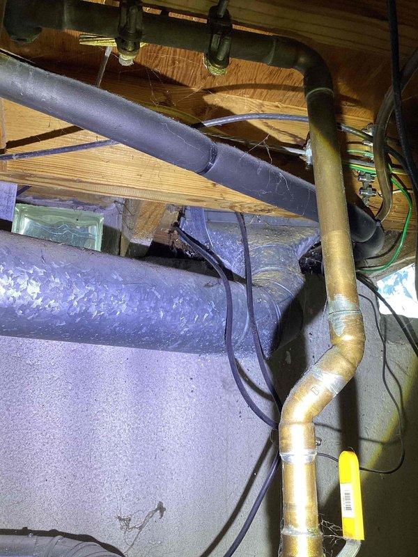 Completed comprehensive HVAC system assessment for full system replacement estimate in residential property. Evaluated existing mechanical infrastructure including ductwork configuration, piping systems, and equipment accessibility in basement and attic spaces. Documented current system layout with multiple utility intersections including HVAC ductwork, plumbing lines, and electrical conduits to determine optimal equipment placement and installation requirements for new system proposal.