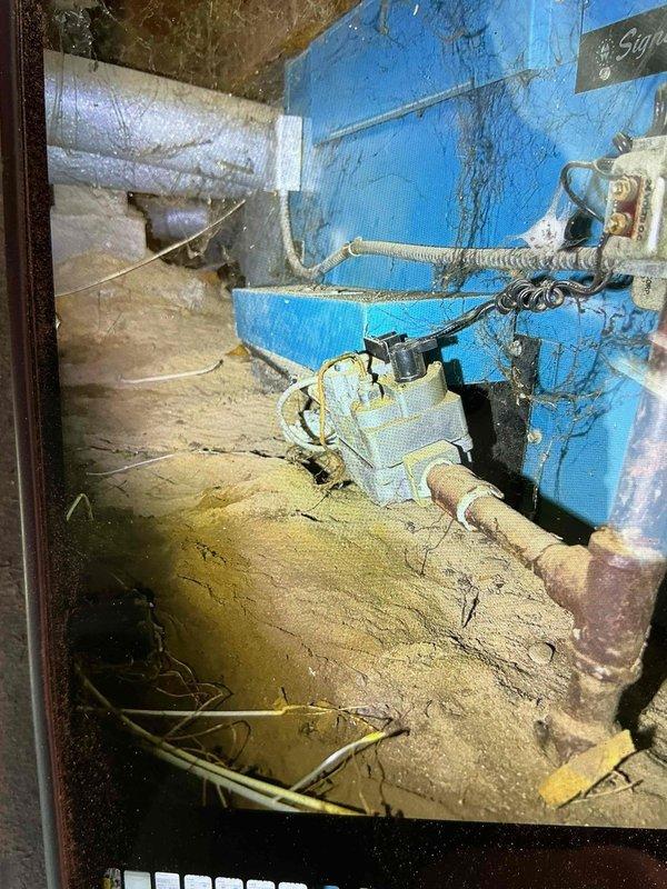 Responded to no heat call for furnace located in crawl space. Upon arrival, found pilot light extinguished on gas furnace. Inspected unit and verified gas supply, thermocouple condition, and pilot assembly functionality. Successfully relit pilot light and confirmed proper ignition sequence and burner operation. Observed evidence of moisture accumulation on adjacent ductwork and mechanical components in crawl space environment. Verified furnace cycling properly with adequate airflow and proper combustion. System restored to normal heating operation.
