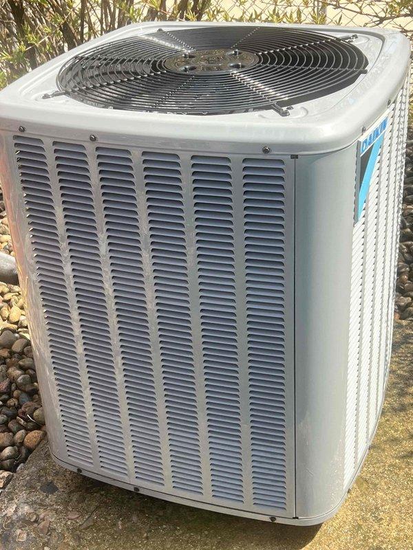 Completed comprehensive Gold AC inspection on 2023 air conditioning system with air handler located in basement and outdoor condenser unit positioned on concrete pad with decorative rock landscaping. Performed full system evaluation including visual inspection of condenser cabinet, fan assembly, and external components, confirming unit operational status and general equipment condition. Advised customer that area surrounding condenser requires clearing of debris and any animal waste to maintain proper airflow and system efficiency.