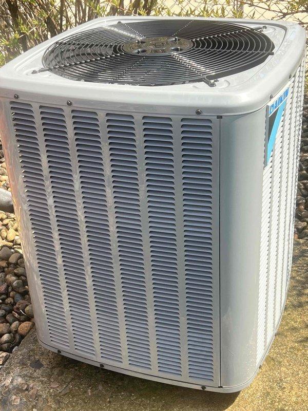 Completed comprehensive Gold AC inspection on 2023 air conditioning system with air handler located in basement and outdoor condenser unit positioned on concrete pad with decorative rock landscaping. Performed full system evaluation including visual inspection of condenser cabinet, fan assembly, and external components, confirming unit operational status and general equipment condition. Advised customer that area surrounding condenser requires clearing of debris and any animal waste to maintain proper airflow and system efficiency.