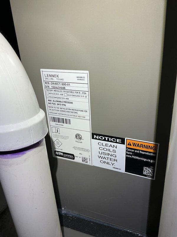 Completed comprehensive Gold AC inspection on Lennox CX40CT-36B-01 air handler unit located in basement. System confirmed operational with equipment under 10 years old. Performed standard inspection protocol including visual examination of unit components, condensate drainage system, and electrical connections. Verified proper PVC condensate line configuration and assessed overall system condition. Provided customer instruction on thermostat programming and advised that outdoor condenser area must be maintained clear of debris and animal waste for optimal performance. Unit labels and safety warnings verified present and legible. All accessible components inspected and found in satisfactory working condition.