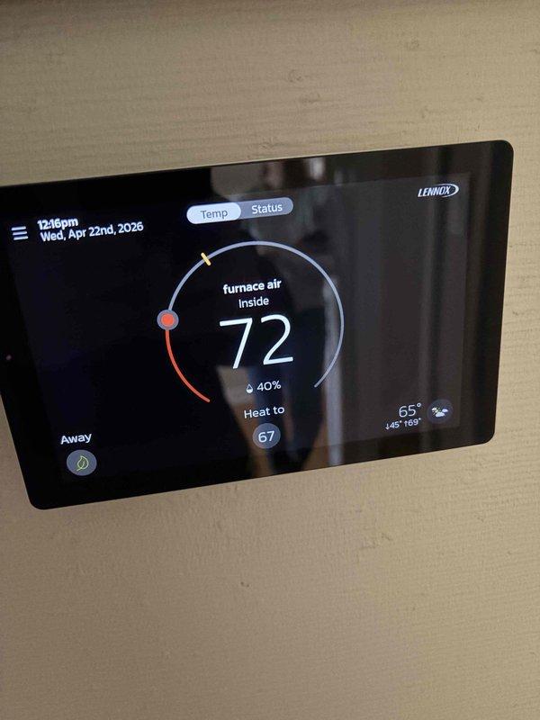 Completed AC system start-up and inspection at residential property with coil located in basement. Verified proper operation of Lennox HVAC system including furnace and air conditioning components. Inspected condensate management system including Sauermann condensate pump and Honeywell zone valve assembly with PVC drain lines, confirming secure mounting and proper drainage. Tested Lennox programmable thermostat functionality, verifying accurate temperature readings, humidity display at 40%, and proper communication with heating system set to maintain 67°F. System operational and running efficiently with all components functioning as designed.