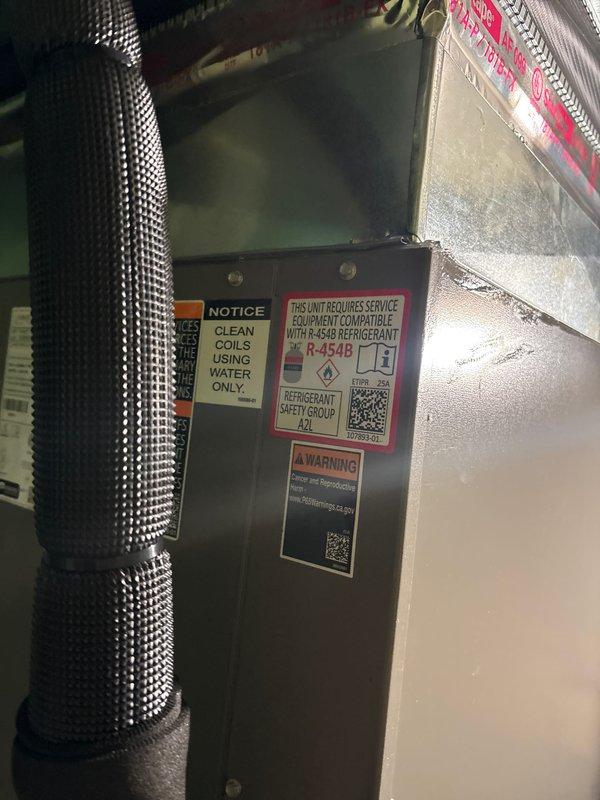 Completed installation of 4-ton air conditioning system with matching evaporator coil utilizing R-454B refrigerant. Unit installed at rear location with electrical reconnection performed. System installed in attic space with proper insulation and ductwork connections, while Bryant furnace and air handler remain in basement mechanical room. Mechanical and electrical permits requested and all manufacturer specifications followed for refrigerant compatibility and coil maintenance requirements.